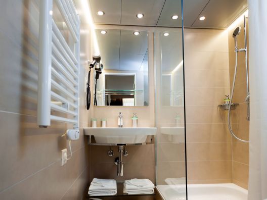 The newly renovated bathroom with a modern and timeless design.